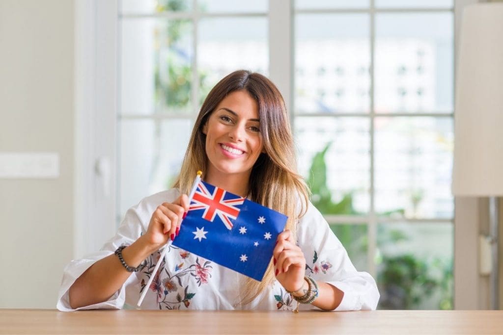 changes to citizenship test, woman holding australian flag